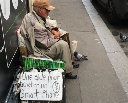 Promotion Kai Hauprich - Bild eines Obdachlosen, der um Geld für ein Handy bettelt